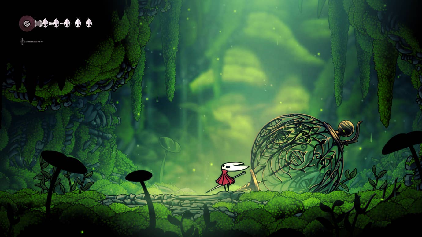 Hornet stands up in a mossy cave in the introduction to Hollow Knight: Silksong.